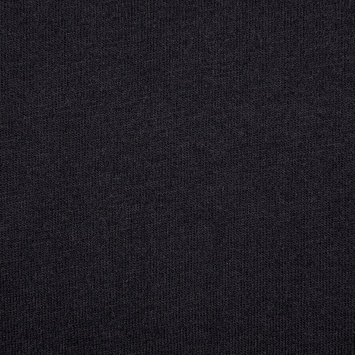 A close up of the black fabric that is used to make the t-shirt.